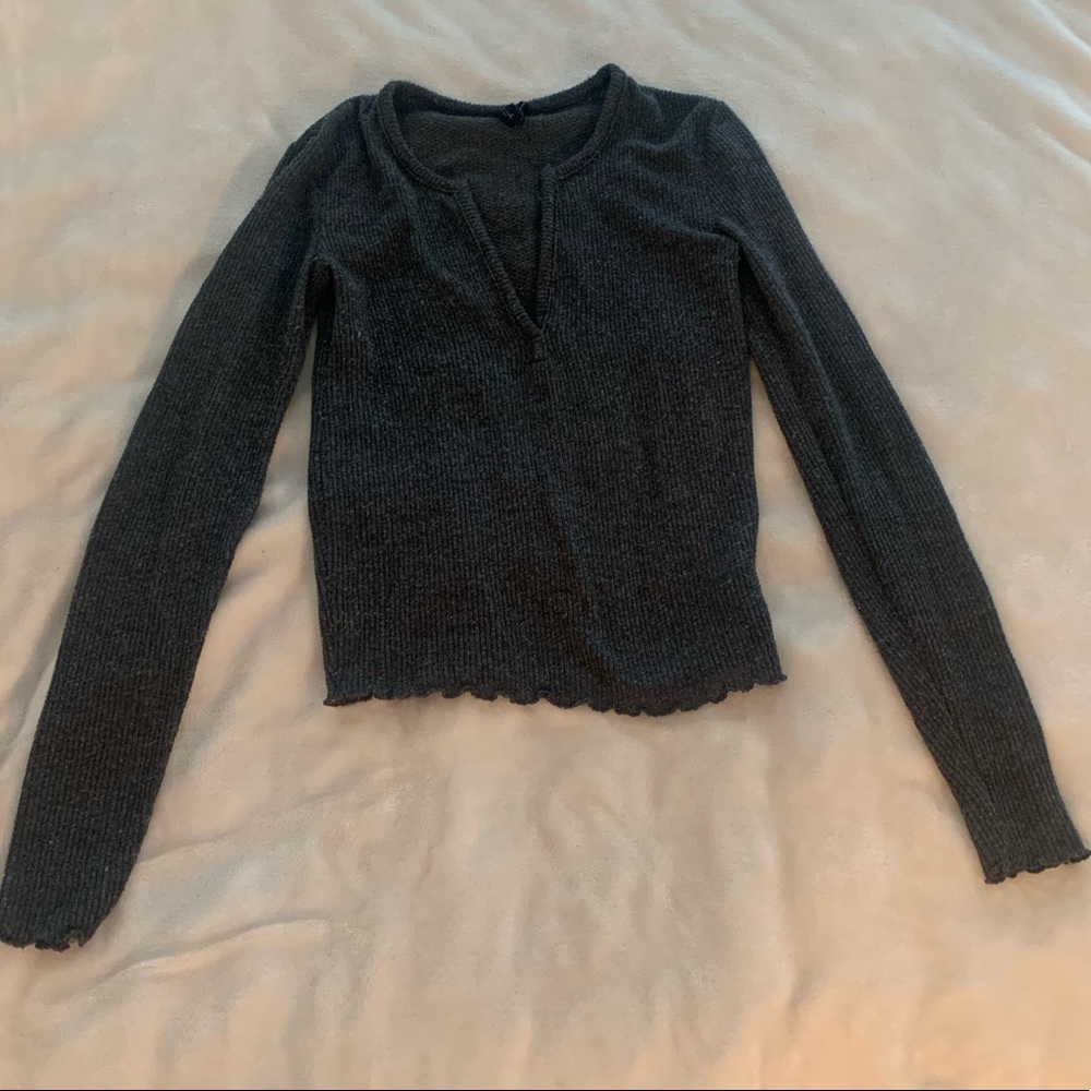 Out from under gray pullover